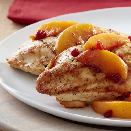 Boneless chicken breasts with lingonberry-peach topping.