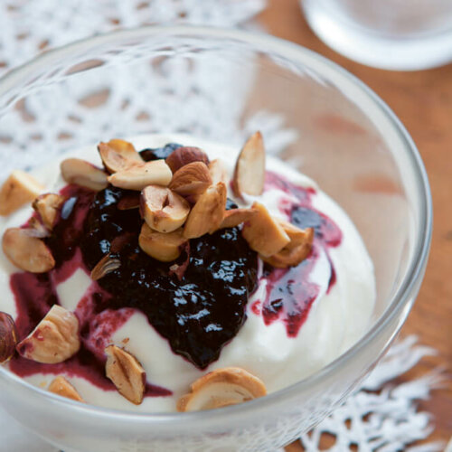 Yogurt, lingonberry jam with blueberries and chopped nuts