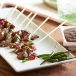 Marinated Beef Satay with spicy chili lingonberry sauce