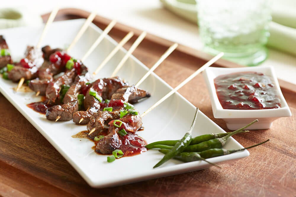 Marinated Beef Satay with spicy chili lingonberry sauce