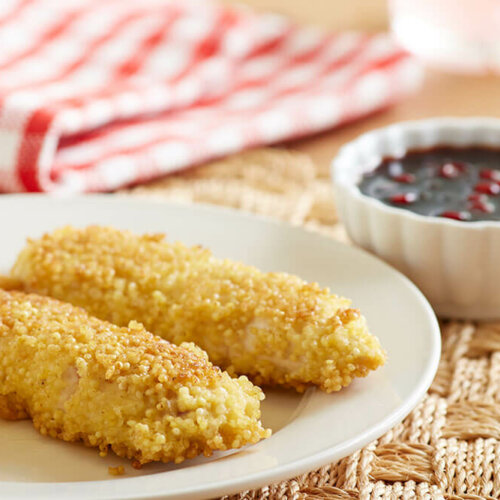 Millet-breaded chicken fingers with lingonberry dipping sauce